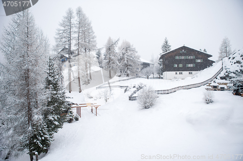 Image of mountain house in snowstorm