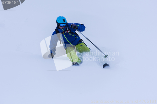 Image of freeride skier skiing downhill