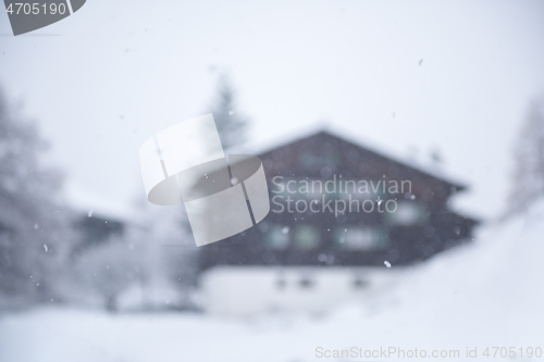 Image of mountain house in snowstorm