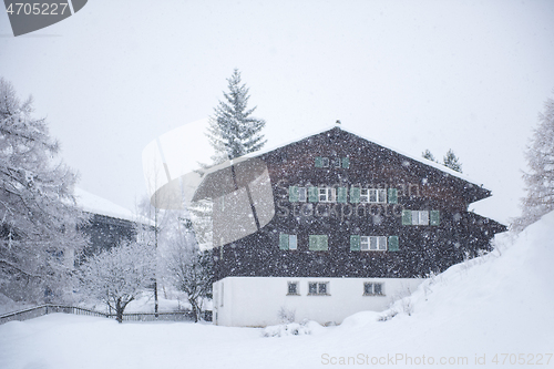 Image of mountain house in snowstorm