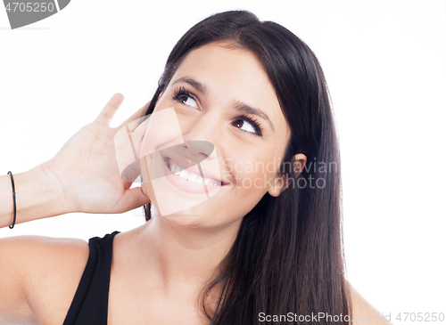 Image of Young woman trying to listen something