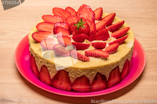 Image of homemade strawberry cake in a red dish
