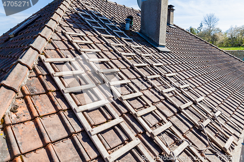 Image of renovation of a brick tiled roof