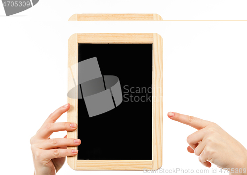 Image of woman\'s hands holding a blackboard publicity