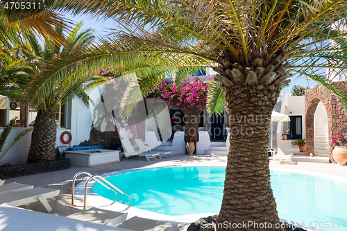 Image of private pool and sun loungers in the sun