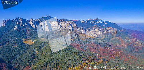 Image of Autumn colored forest in mountains.