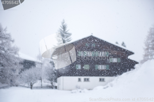 Image of mountain house in snowstorm