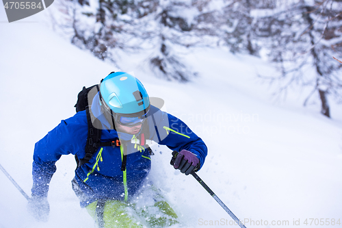 Image of freeride skier skiing downhill