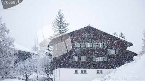 Image of mountain house in snowstorm