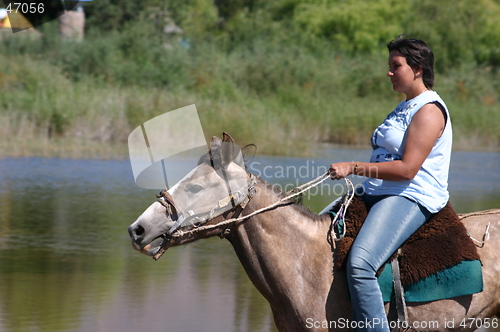 Image of Girl riding on horse