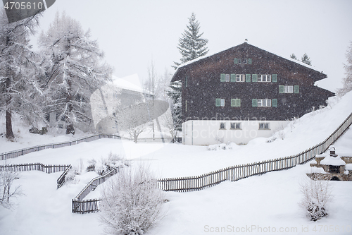 Image of mountain house in snowstorm