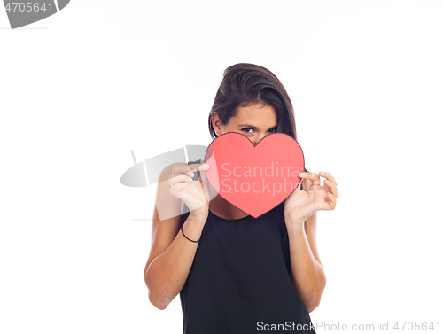 Image of beautiful happy young woman who is holding a big red heart for v