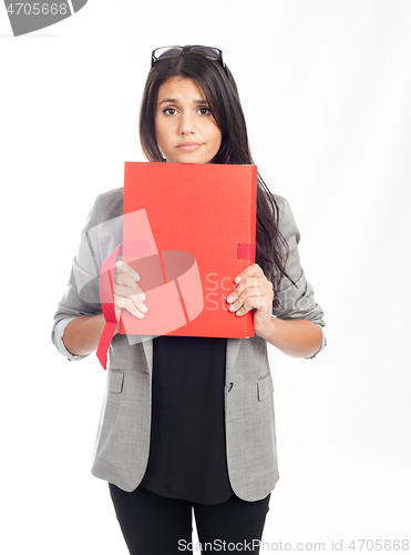 Image of beautiful young businesswoman with a red folder