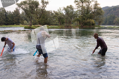 Image of young men having fun with water guns