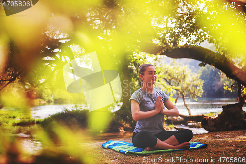 Image of woman meditating and doing yoga exercise