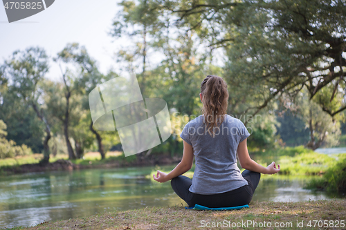 Image of woman meditating and doing yoga exercise