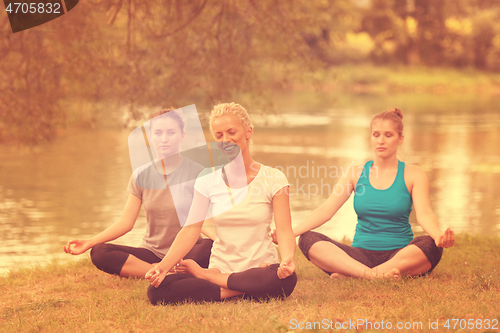 Image of women meditating and doing yoga exercise