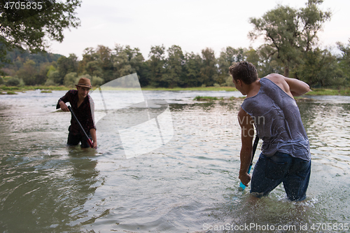 Image of young men having fun with water guns