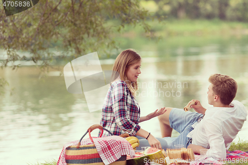 Image of Couple in love enjoying picnic time