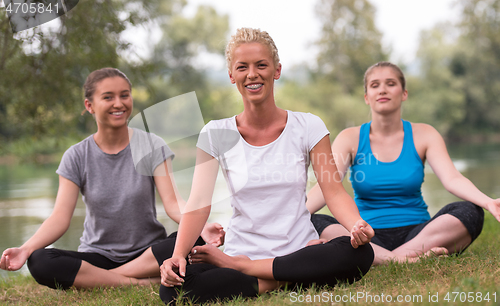 Image of women meditating and doing yoga exercise