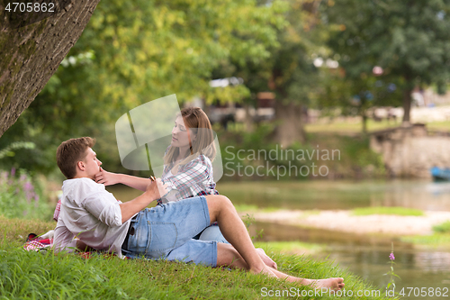 Image of Couple in love enjoying picnic time