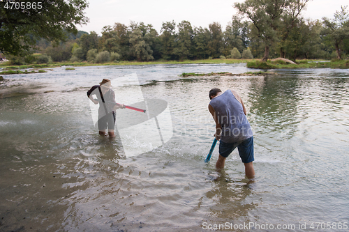 Image of young men having fun with water guns