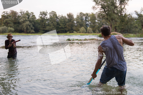 Image of young men having fun with water guns