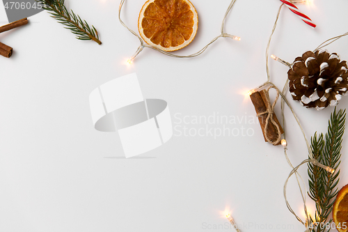 Image of frame of garland lights and christmas decorations