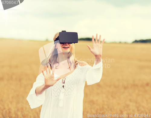 Image of woman in virtual reality headset on cereal field