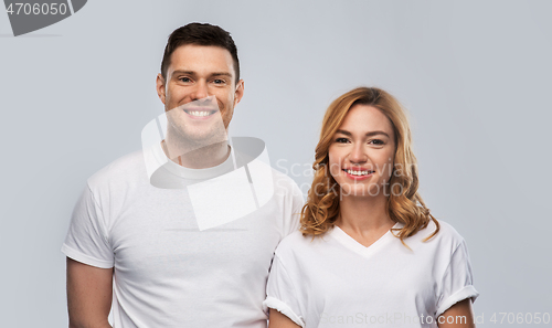 Image of portrait of happy couple in white t-shirts