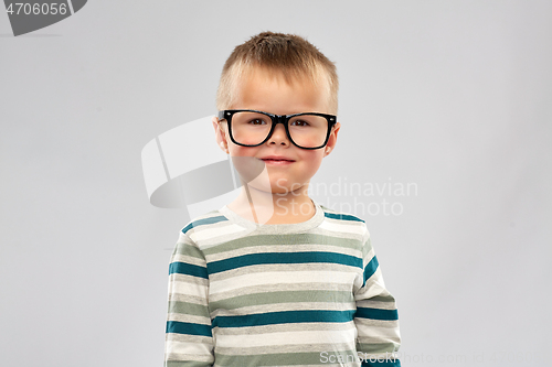 Image of portrait of smiling little boy in glasses