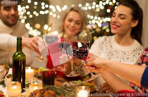 Image of close up of friends with wine celebrate christmas