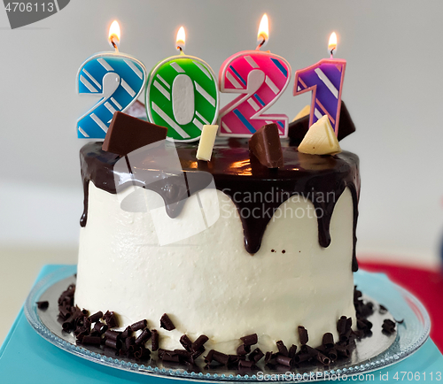 Image of New Year cake 2021 with colourful candles