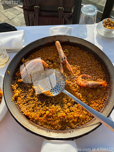 Image of Amazing dinner with traditional Spanish paella in El Palmar