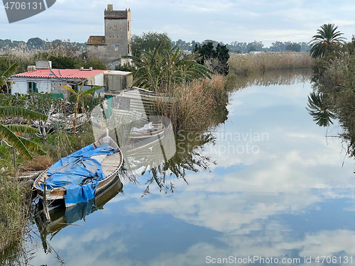 Image of Village scene with abandoned house and boats. El Palmar, Spain