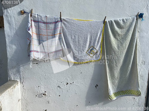 Image of Drying towels in the village