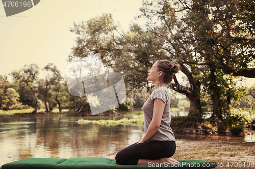 Image of woman meditating and doing yoga exercise