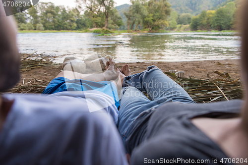 Image of couple spending time together in straw tent