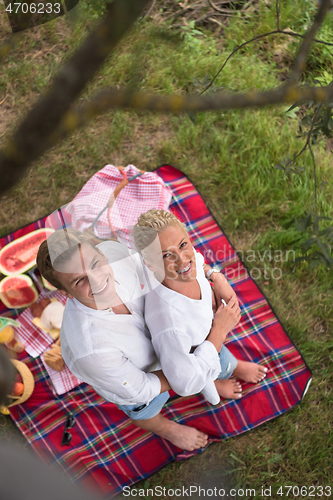 Image of top view of couple enjoying picnic time