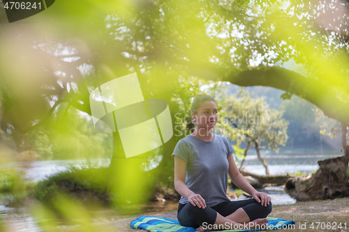 Image of woman meditating and doing yoga exercise