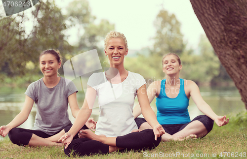 Image of women meditating and doing yoga exercise