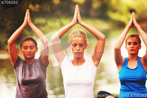 Image of women meditating and doing yoga exercise