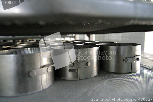 Image of cheese moulds in modern dairy factory