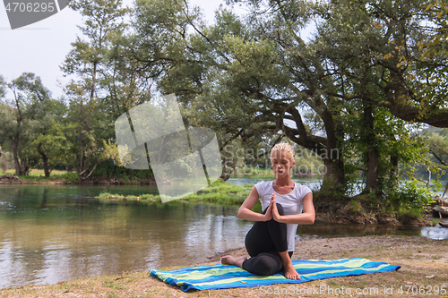 Image of woman meditating and doing yoga exercise