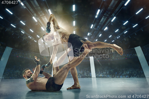 Image of Two professional boxers boxing on the ring