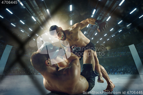 Image of Two professional boxers boxing on the ring