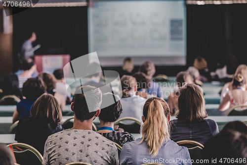 Image of Audience in lecture hall participating at business conference.