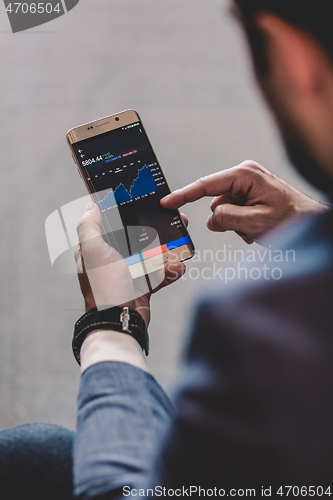 Image of Close up of businessman using mobile smart phone.