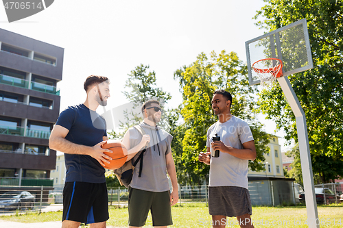 Image of group of male friends going to play basketball