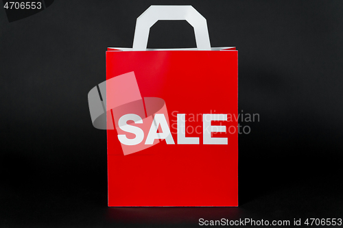 Image of red shopping bag with sale word